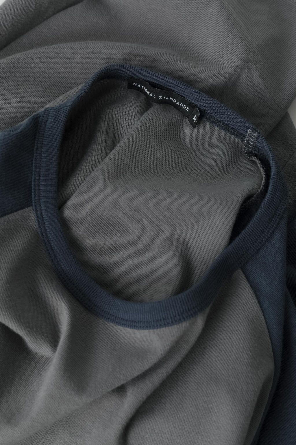 Fabric detail of the ready-to-wear Spun Jersey Raglan in Grey / Blue 007